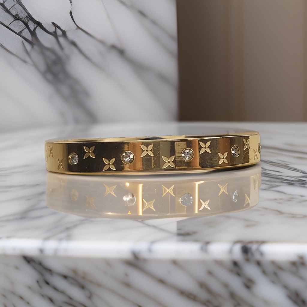 Add a touch of floral charm to your look with our Beautiful Dior Flower Bracelet. Featuring intricate flower details, this bracelet is perfect for adding a feminine touch to any ensemble. Made from high-quality materials, it's durable and long-lasting.