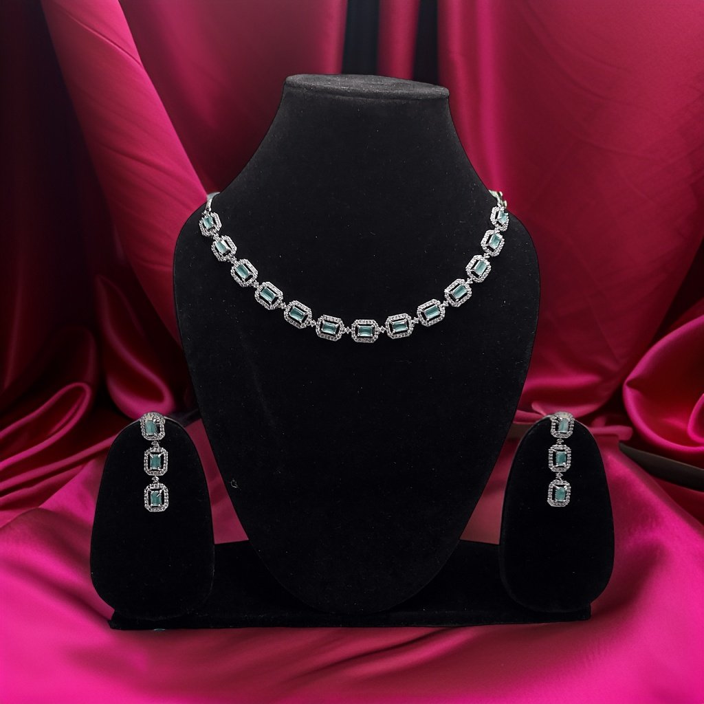 Make a bold statement with our Blue American Diamond Necklace. This eye-catching piece features blue American diamond accents that sparkle and shine. The adjustable chain ensures a perfect fit, making it suitable for all necklines.