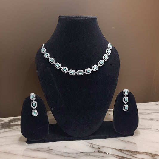 Make a bold statement with our Blue American Diamond Necklace. This eye-catching piece features blue American diamond accents that sparkle and shine. The adjustable chain ensures a perfect fit, making it suitable for all necklines.