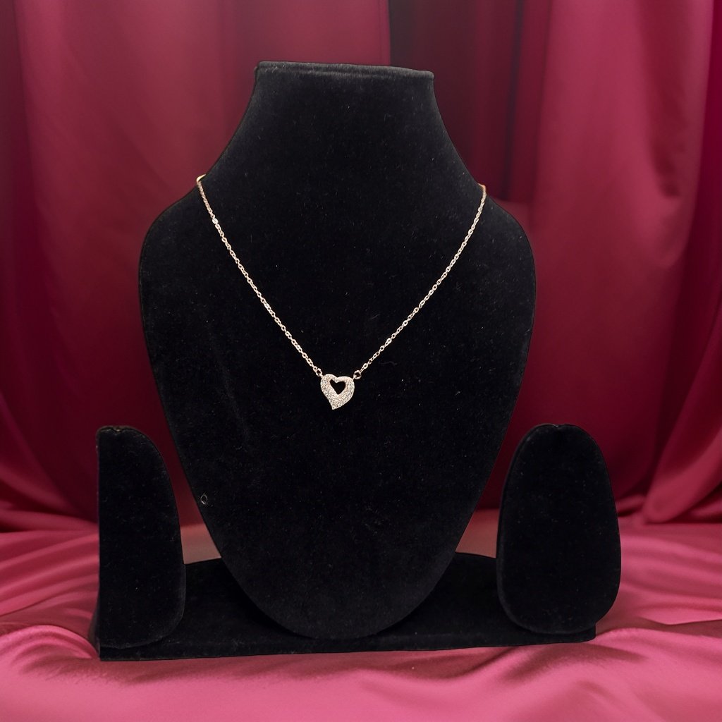 Add a touch of romance to your look with our <em>Elegant Heart Pendant</em>. This stunning piece features an elegant heart-shaped pendant that symbolizes love and affection. The adjustable chain ensures a comfortable fit, making it suitable for all occasions.
