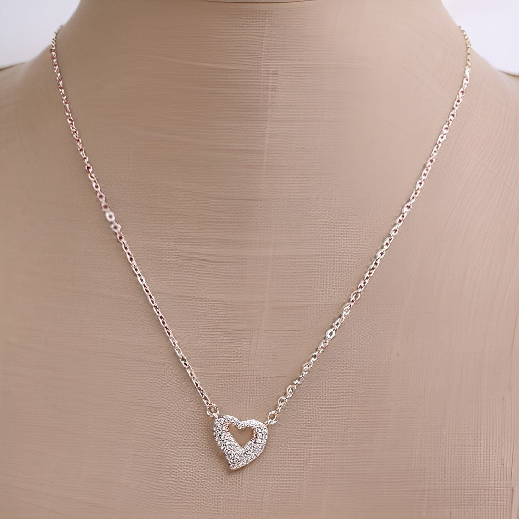 Add a touch of romance to your look with our <em>Elegant Heart Pendant</em>. This stunning piece features an elegant heart-shaped pendant that symbolizes love and affection. The adjustable chain ensures a comfortable fit, making it suitable for all occasions.