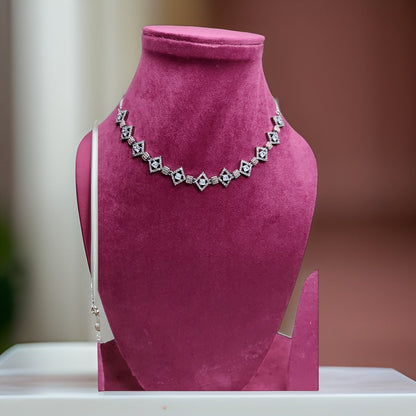 Add a touch of glamour to your ensemble with our Fancy Link American Diamond Necklace. Featuring intricate fancy links and sparkling American diamond accents, this necklace exudes elegance and sophistication. The adjustable chain ensures a comfortable fit, making it suitable for all necklines.