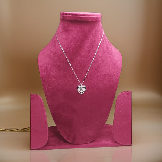 Add a touch of romance to your look with our Heart Pendant. This sweet piece features a heart design that symbolizes love and affection. The adjustable chain ensures a comfortable fit, making it suitable for all necklines.
