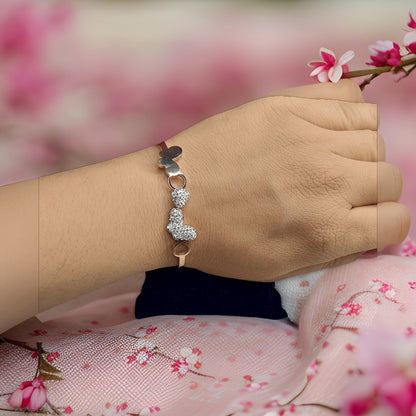 Add a playful touch to your look with our Kuhu Kiss Bracelet. Featuring adorable kiss-shaped charms, this bracelet is perfect for adding a fun and flirty vibe to any ensemble. The adjustable chain ensures a perfect fit, making it suitable for all wrist sizes.