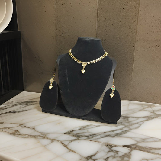 Elevate your look with our Kuhu Necklace. This stunning piece exudes sophistication with its timeless design and superior craftsmanship. Whether worn alone or layered with other necklaces, it adds a touch of glamour to any outfit.