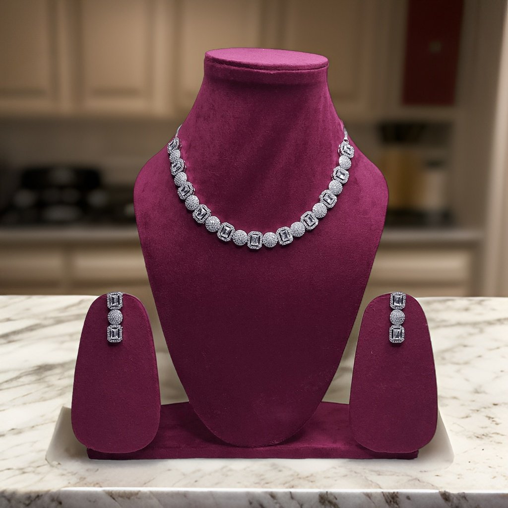 Make a statement with our Long Drop American Diamond Necklace. Featuring a long drop design with sparkling American diamond accents, this necklace adds instant glamour to any ensemble. The adjustable length ensures a comfortable fit, making it suitable for all occasions.