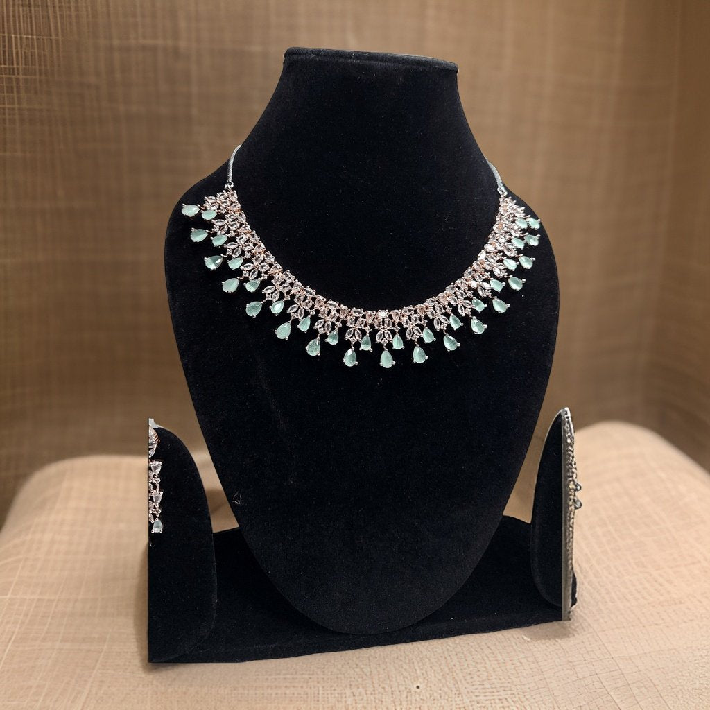 Add a touch of freshness to your look with our Mint Drop Necklace. Featuring mint-colored accents, this necklace exudes a refreshing vibe. The adjustable chain ensures a comfortable fit, making it suitable for all necklines.