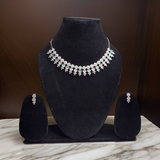 Add a burst of color to your neckline with our Multi Color American Diamond Necklace. This vibrant piece features sparkling American diamond accents in a variety of colors for a playful look. The adjustable length ensures a comfortable fit, making it suitable for all occasions.