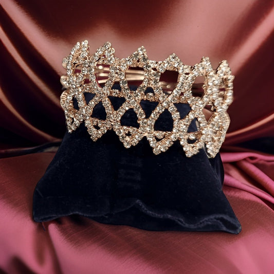 Feel like royalty with our Princess Tiara Bracelet. This elegant accessory features a tiara-inspired design that adds a regal touch to any ensemble. The adjustable length ensures a comfortable fit, making it suitable for all wrist sizes.