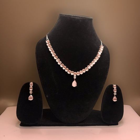 Add a touch of femininity to your ensemble with our Round and Pear Cut Pink Necklace. This stylish piece features round and pear-cut pink accents that add a pop of color to any look. The adjustable length ensures a comfortable fit, making it suitable for all occasions.