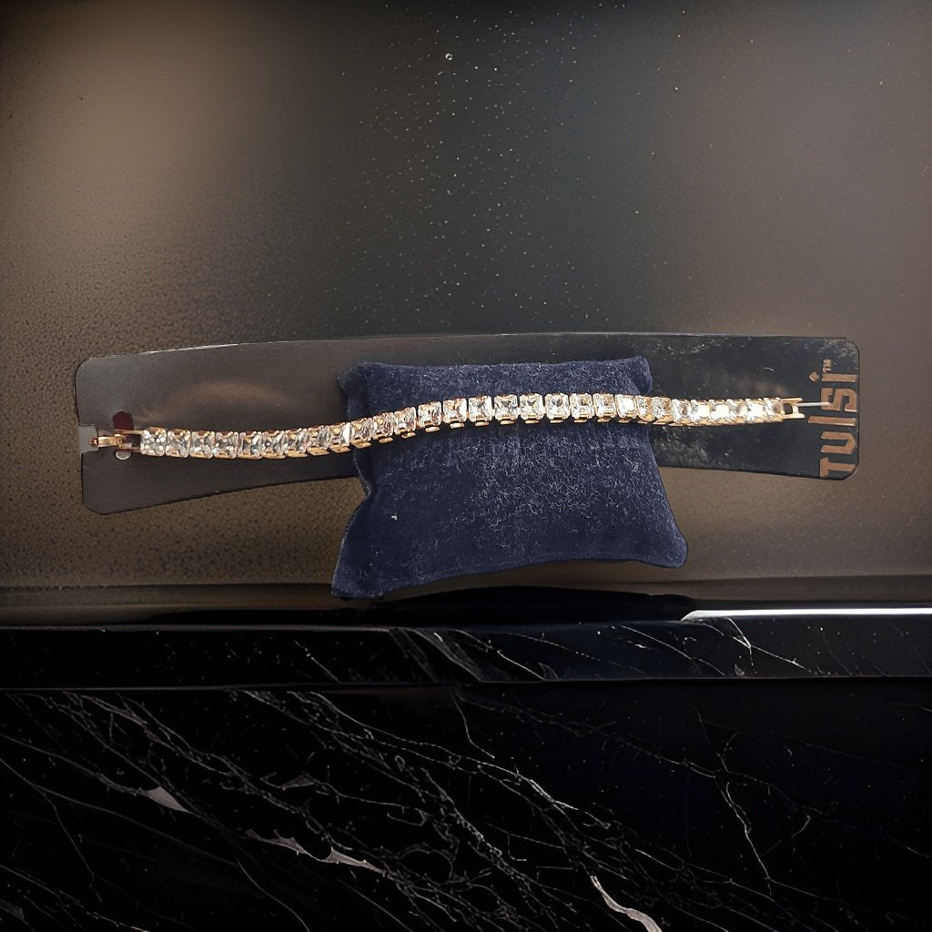 Elevate your wrist game with our Tennis Bracelet. This classic accessory features a timeless design with sparkling stones that wrap around your wrist. The adjustable length ensures a comfortable fit, making it suitable for all occasions.